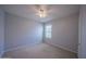 Neutral bedroom with a ceiling fan, one window, and carpeted flooring at 5263 Bear Corn Run, Port Orange, FL 32128