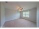 Relaxing bedroom with a ceiling fan, window and neutral carpet flooring at 5263 Bear Corn Run, Port Orange, FL 32128
