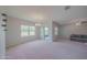 Spacious living room featuring sliding glass doors to the patio at 5263 Bear Corn Run, Port Orange, FL 32128