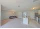 Open layout featuring a kitchen island, with the living room providing ample seating at 5263 Bear Corn Run, Port Orange, FL 32128