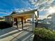 Community pool house with gated entry offering restrooms and a covered patio area for residents to enjoy at 5263 Bear Corn Run, Port Orange, FL 32128