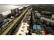 Aerial view of the complex, featuring tennis courts, deeded beach access and views of the ocean at 5300 S Atlantic Ave # 11302, New Smyrna Beach, FL 32169