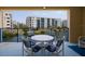 Scenic balcony with comfortable seating overlooking a tranquil waterfront, perfect for enjoying the outdoors at 5300 S Atlantic Ave # 11302, New Smyrna Beach, FL 32169