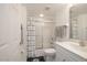 Bright bathroom with a shower-tub combo, anchor-themed curtain, and ample counter space providing functionality and charm at 5300 S Atlantic Ave # 11302, New Smyrna Beach, FL 32169