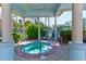 Enclosed hot tub features a tiled interior, sitting area and exterior views of the property at 5300 S Atlantic Ave # 11302, New Smyrna Beach, FL 32169