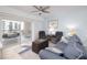 Comfortable living room featuring stylish decor, plush seating, and access to a private balcony at 5300 S Atlantic Ave # 11302, New Smyrna Beach, FL 32169