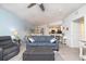 Bright and spacious living room featuring a coastal decor, a large sofa, a dining room, and an open kitchen at 5300 S Atlantic Ave # 11302, New Smyrna Beach, FL 32169