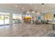 Well-lit lounge area features ample seating, a kitchenette, and large windows with natural light at 5300 S Atlantic Ave # 11302, New Smyrna Beach, FL 32169