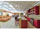 Community lounge area with kitchen space, comfortable seating and tiled floors at 5300 S Atlantic Ave # 11302, New Smyrna Beach, FL 32169
