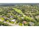 Gorgeous aerial shot of a lush golf course community with mature trees and well-maintained homes at 544 Bottlebrush Ct, New Smyrna Beach, FL 32168