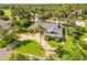 Aerial view showcasing a home surrounded by lush greenery and mature trees at 544 Bottlebrush Ct, New Smyrna Beach, FL 32168