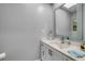 Bathroom featuring a single sink vanity with stone counters and modern fixtures at 544 Bottlebrush Ct, New Smyrna Beach, FL 32168
