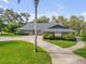 Stunning home with well-kept lawn, mature landscaping, and circular driveway at 544 Bottlebrush Ct, New Smyrna Beach, FL 32168