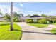 Charming single-story home boasts a long drive and is surrounded by mature landscaping at 544 Bottlebrush Ct, New Smyrna Beach, FL 32168