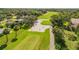 Picturesque golf course view featuring manicured greens, sand traps, and mature trees at 544 Bottlebrush Ct, New Smyrna Beach, FL 32168
