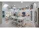 Bright kitchen with a large center island, stainless steel appliances, and stylish white cabinetry at 544 Bottlebrush Ct, New Smyrna Beach, FL 32168