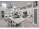 Bright, open kitchen featuring a large island, stainless appliances, and ample storage at 544 Bottlebrush Ct, New Smyrna Beach, FL 32168