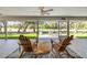 Relaxing screened lanai with comfortable seating overlooking a lush outdoor view at 544 Bottlebrush Ct, New Smyrna Beach, FL 32168