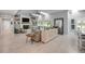 Bright living room with a fireplace, comfortable seating, and sliding glass doors to the outside at 544 Bottlebrush Ct, New Smyrna Beach, FL 32168
