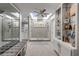 Bright main bathroom features skylights, a glass enclosed shower, and modern tile work at 544 Bottlebrush Ct, New Smyrna Beach, FL 32168