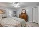 Bedroom featuring a decorative wood dresser and a bed with a quilted coverlet at 544 Bottlebrush Ct, New Smyrna Beach, FL 32168