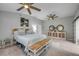 Bright main bedroom features tiled floor, neutral tones, and coastal inspired decor at 544 Bottlebrush Ct, New Smyrna Beach, FL 32168