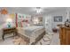 Comfortable bedroom with a decorative wood-frame bed and white rug at 544 Bottlebrush Ct, New Smyrna Beach, FL 32168