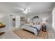 Comfortable main bedroom with a queen bed, a fish wall art, and neutral-colored walls at 544 Bottlebrush Ct, New Smyrna Beach, FL 32168