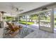 Inviting screened-in patio with views of the golf course and lush landscaping at 544 Bottlebrush Ct, New Smyrna Beach, FL 32168