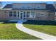 Spacious backyard with a sidewalk leading to the home's sunroom at 5832 Michelle Ln, Sanford, FL 32771