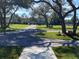 Long, paved driveway winding through a lush, tree-lined yard, leading to a home in a serene setting at 5832 Michelle Ln, Sanford, FL 32771