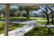 Scenic view of a long driveway lined with mature trees, leading to a charming home in a tranquil setting at 5832 Michelle Ln, Sanford, FL 32771