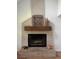 Cozy living room fireplace with light brick, wooden mantle, and decorative elements at 5832 Michelle Ln, Sanford, FL 32771