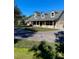 Charming two-story home with a brick facade, dormer windows and circular driveway at 5832 Michelle Ln, Sanford, FL 32771