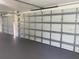 Garage interior with two closed garage doors at 5832 Michelle Ln, Sanford, FL 32771