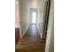 Hallway featuring wood laminate flooring and neutral color palette at 5832 Michelle Ln, Sanford, FL 32771