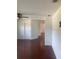 An entrance hallway showing a hall and the dark hardwood flooring throughout at 5832 Michelle Ln, Sanford, FL 32771
