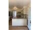 Open concept kitchen featuring granite counters, gas range, white cabinets and stainless appliances at 5832 Michelle Ln, Sanford, FL 32771