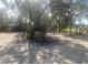 A large, tree-filled lot ready for a new home build in a quiet, wooded neighborhood at 5832 Michelle Ln, Sanford, FL 32771