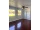 Spacious living room featuring hardwood floors, and natural light from the exterior windows at 5832 Michelle Ln, Sanford, FL 32771