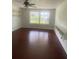 Living Room with hardwood floors and view of the lawn and trees at 5832 Michelle Ln, Sanford, FL 32771