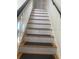 Staircase with white risers and wooden treads with dark gray stair runner at 5832 Michelle Ln, Sanford, FL 32771