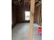 Unfinished basement showing exposed framing, floors, and window ready for your vision at 585 Washington St, New Smyrna Beach, FL 32168