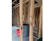 Unfinished basement showing exposed framing and supplies ready for your vision at 585 Washington St, New Smyrna Beach, FL 32168
