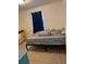 Bedroom with neutral walls, a bed, and tiled floors at 585 Washington St, New Smyrna Beach, FL 32168