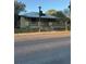 Charming single-story home with a quaint front porch and a landscaped front yard at 585 Washington St, New Smyrna Beach, FL 32168