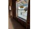 Interior view of a window overlooking the exterior, shows some construction at 585 Washington St, New Smyrna Beach, FL 32168