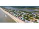 Breathtaking aerial view of the beach house, nestled along the ocean and sandy beach at 6883 S Atlantic Ave, New Smyrna Beach, FL 32169