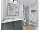 Bright bathroom features modern vanity, shower and updated fixtures at 6883 S Atlantic Ave, New Smyrna Beach, FL 32169