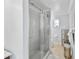 Modern bathroom featuring a glass enclosed shower and neutral color palette at 6883 S Atlantic Ave, New Smyrna Beach, FL 32169